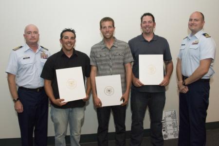 Coast Guard recognizes rescuers of three from capsized boat