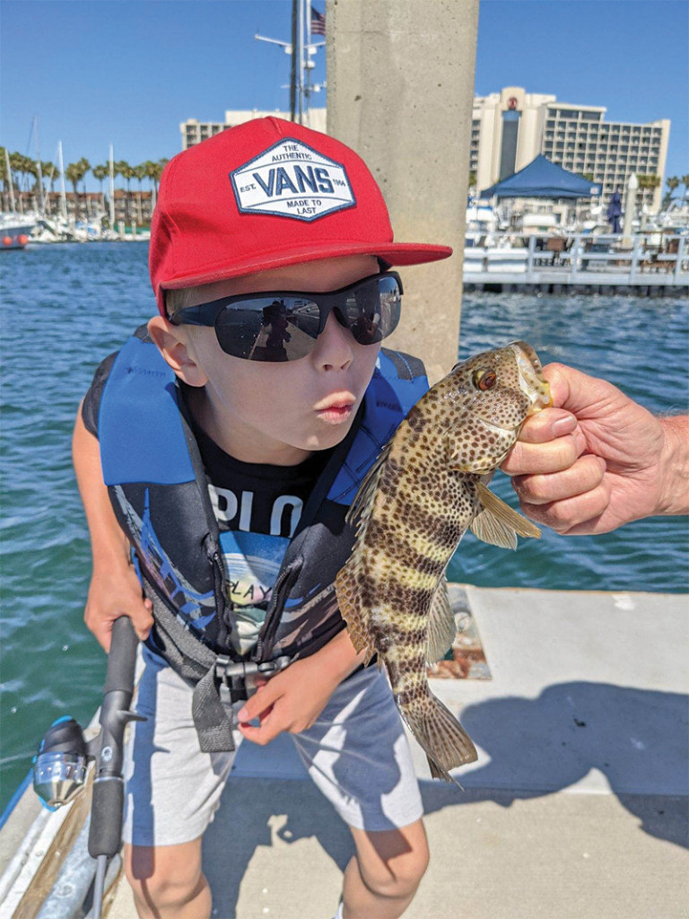 Boy kisses his fish